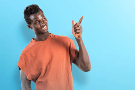 Happy black man thinkingの写真素材