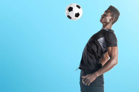 Black man playing footballの写真素材