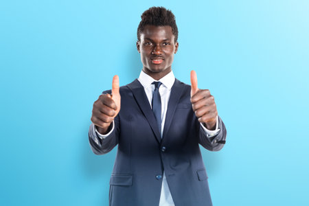 Handsome black man with thumb upの写真素材