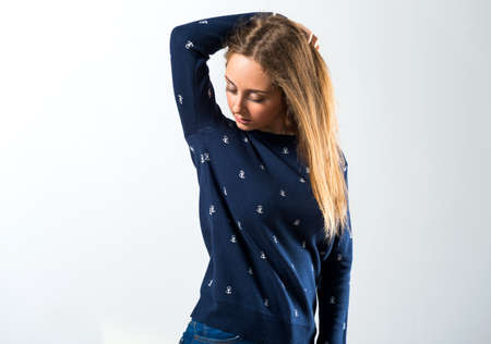 Blonde teen girl posing in studioの写真素材