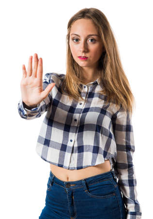 Blonde teen girl making stop signの写真素材