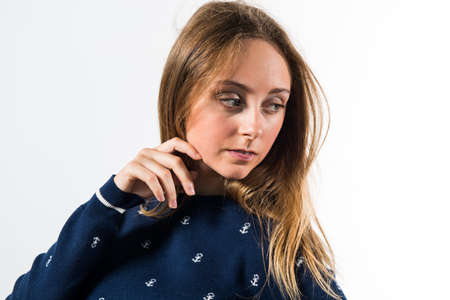 Blonde teen girl posing in studio