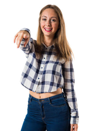 Blonde teen girl pointing to the frontの写真素材
