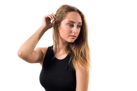 Blonde teen girl posing in studioの写真素材