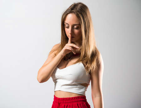 Blonde teen girl posing in studioの写真素材