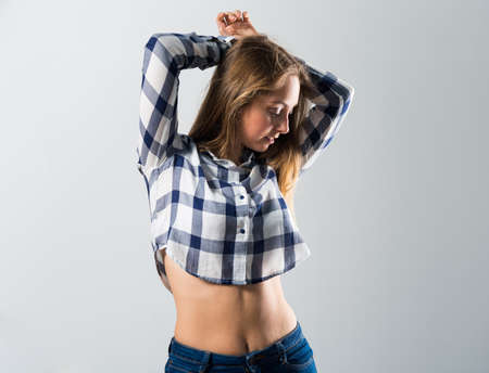 Blonde teen girl posing in studioの写真素材