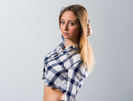 Blonde teen girl posing in studioの写真素材
