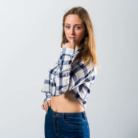 Blonde teen girl posing in studioの写真素材