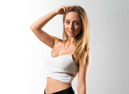 Blonde teen girl posing in studio