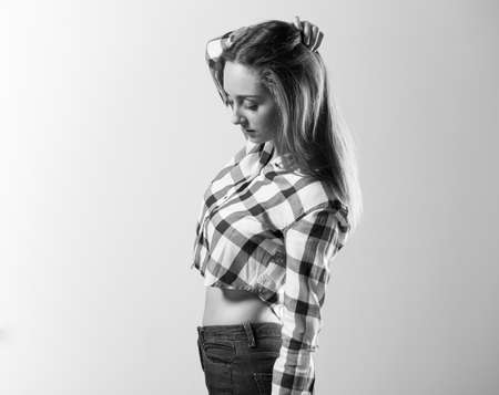 Blonde teen girl posing in studioの写真素材