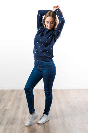 Blonde teen girl posing in studioの写真素材