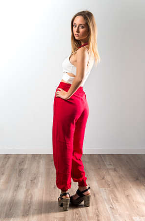 Blonde teen girl posing in studioの写真素材