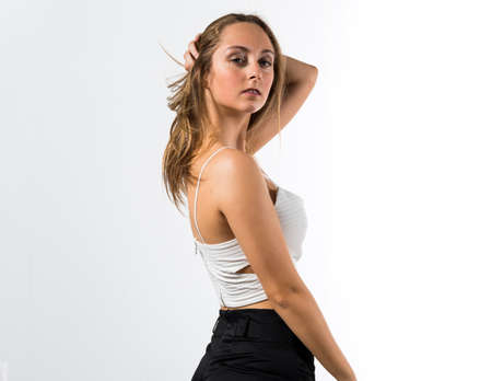 Blonde teen girl posing in studioの写真素材