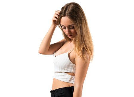 Blonde teen girl posing in studioの写真素材