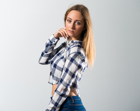 Blonde teen girl posing in studioの写真素材