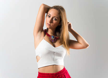 Blonde teen girl posing in studioの写真素材