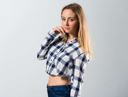 Blonde teen girl posing in studioの写真素材