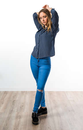 Blonde teen girl posing in studioの写真素材