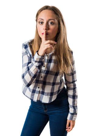Blonde teen girl making silence gestureの写真素材