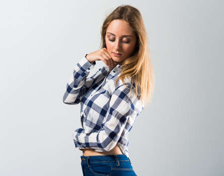Blonde teen girl posing in studioの写真素材
