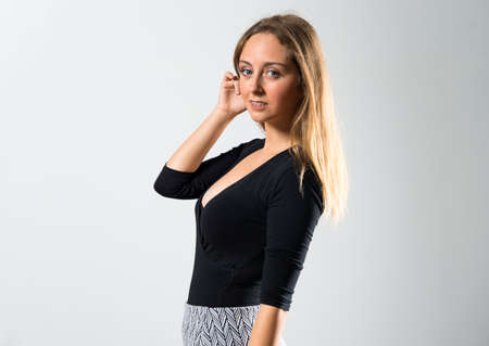 Blonde teen girl posing in studioの写真素材