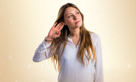 Teen girl listening somethingの写真素材