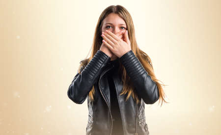 Teen girl covering her mouthの写真素材