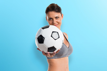 Sport woman playing footballの写真素材