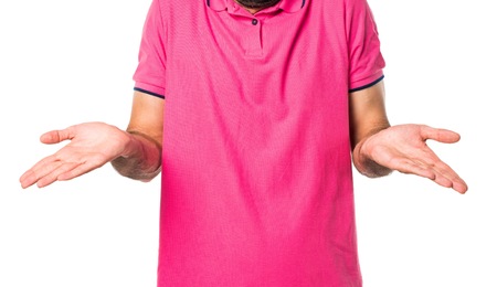 Man with colorful clothes making unimportant gestureの写真素材