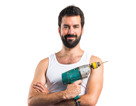 Young electrical technician with a drillの写真素材