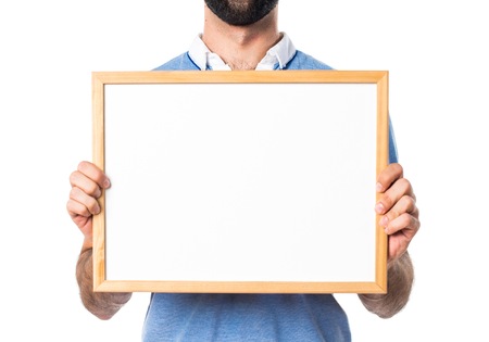 Man with blue shirt holding an empty placardの写真素材