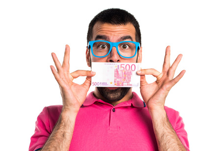 Man with colorful clothes taking a lot of money
