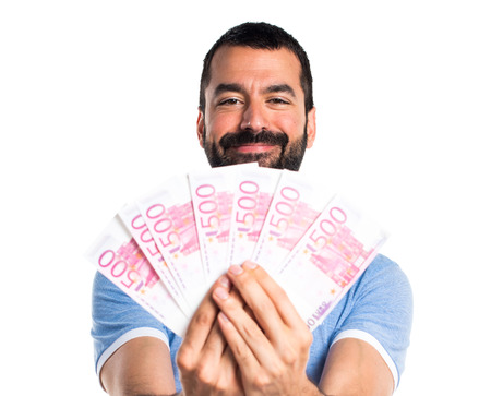 Man with blue shirt taking a lot of moneyの写真素材