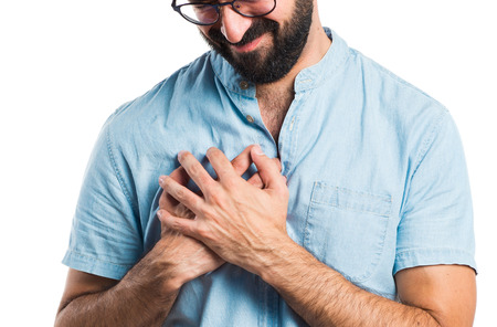 Handsome man with blue glasses with heart painの写真素材