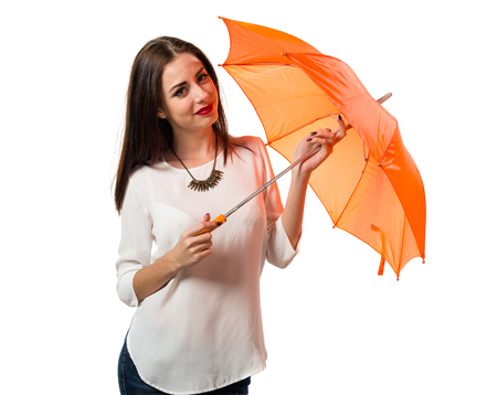 Pretty young girl holding an umbrellaの写真素材