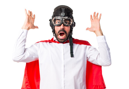 Crazy superhero man doing surprise gestureの写真素材