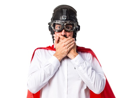 Crazy superhero man covering his mouthの写真素材