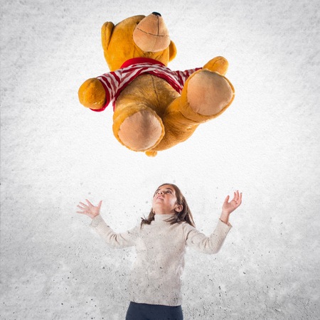Kid playing with stuffed animalの写真素材