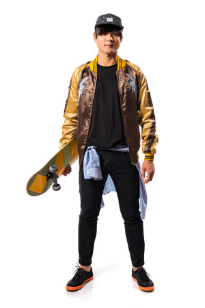 Asian urban man with skateの写真素材
