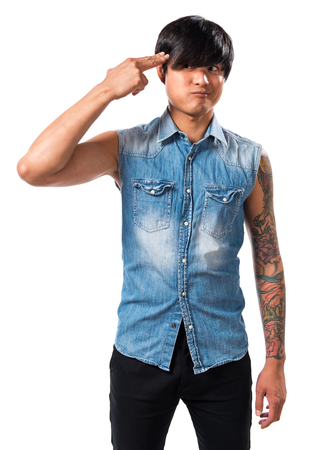 Asian handsome man making gun gestureの写真素材