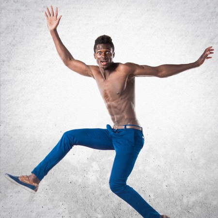 Handsome black man jumpingの写真素材