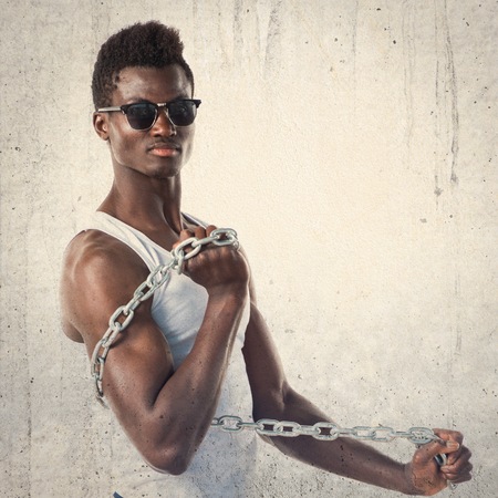 Handsome man with sunglasses and chainsの写真素材