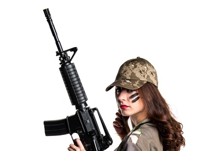 Military woman holding a rifleの写真素材