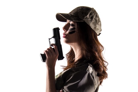 Military girl holding a pistolの写真素材