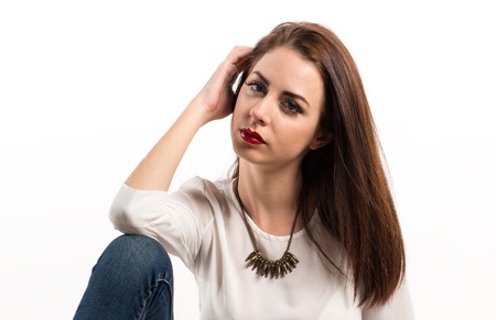 Young pretty model woman posing in studio