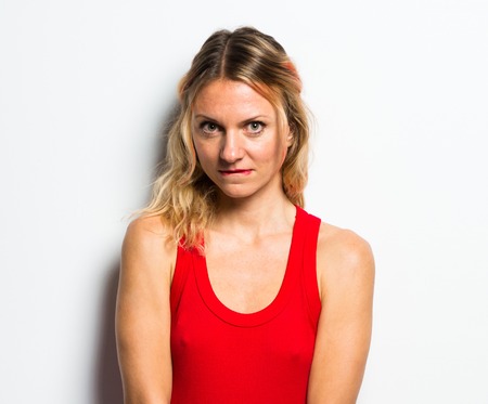 Beautiful blonde woman in red dressの写真素材