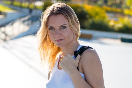 Beautiful woman with backpack outdoors