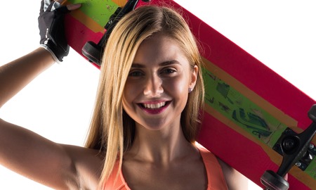 Blonde woman with skateの写真素材