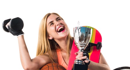 Sport girl with a lot of sport itemsの写真素材