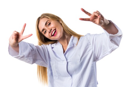 Doctor woman doing victory gestureの写真素材